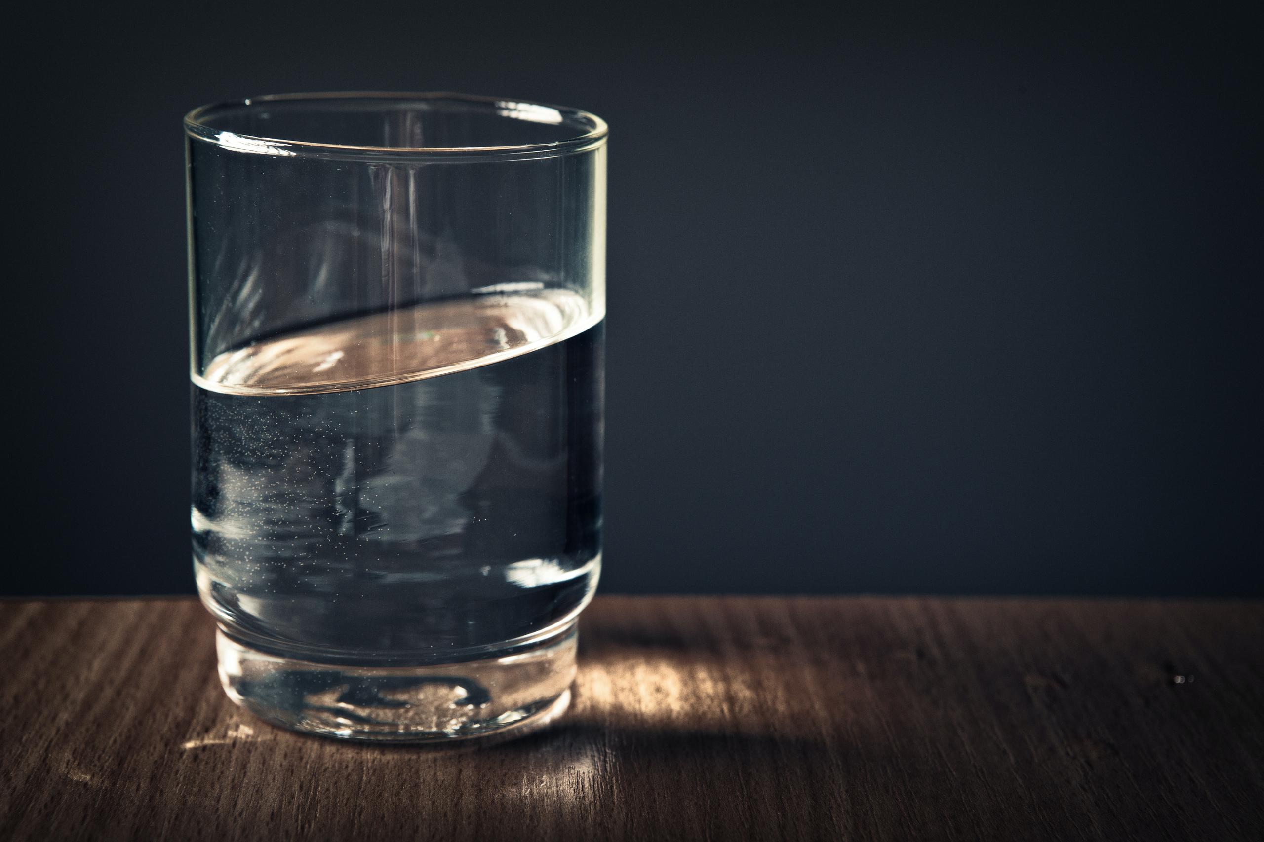 A Glass Of Water On Table