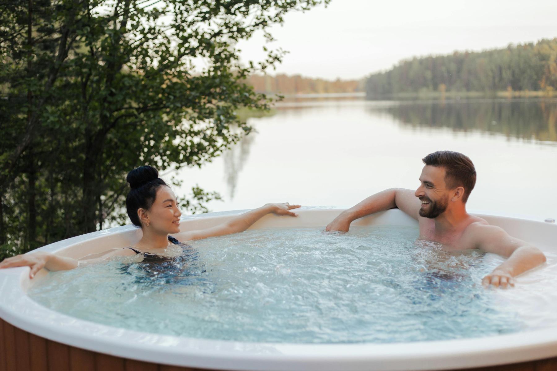 two people sat in a hot tub outside